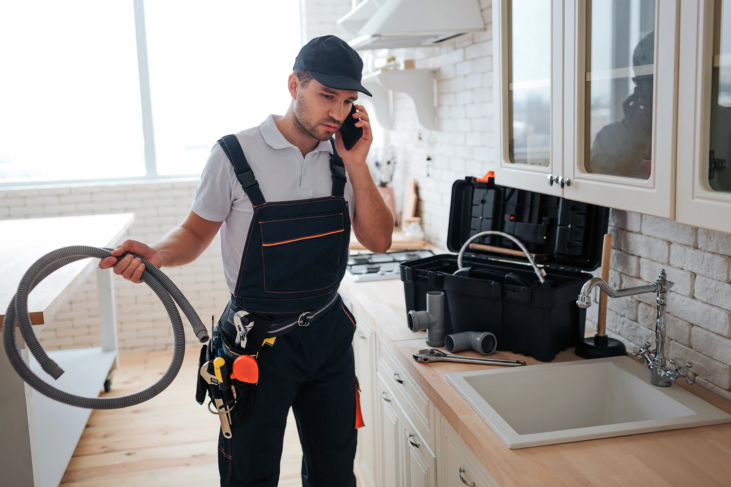 A service technician taking a customer call on the job